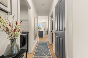 Hallway of the updated Lacey home with fresh interior finishes and LVP flooring.
