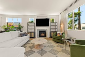 Open-concept living space with fireplace inside the three-bedroom Lacey home.