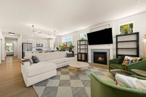 Open-concept living space with fireplace inside the three-bedroom Lacey home.