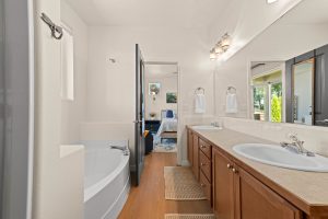 Updated private ensuite bathroom connected to the primary bedroom.